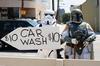 Princess Leia Washing Car Surround by Stormtrooper and Darth Vader for Charity